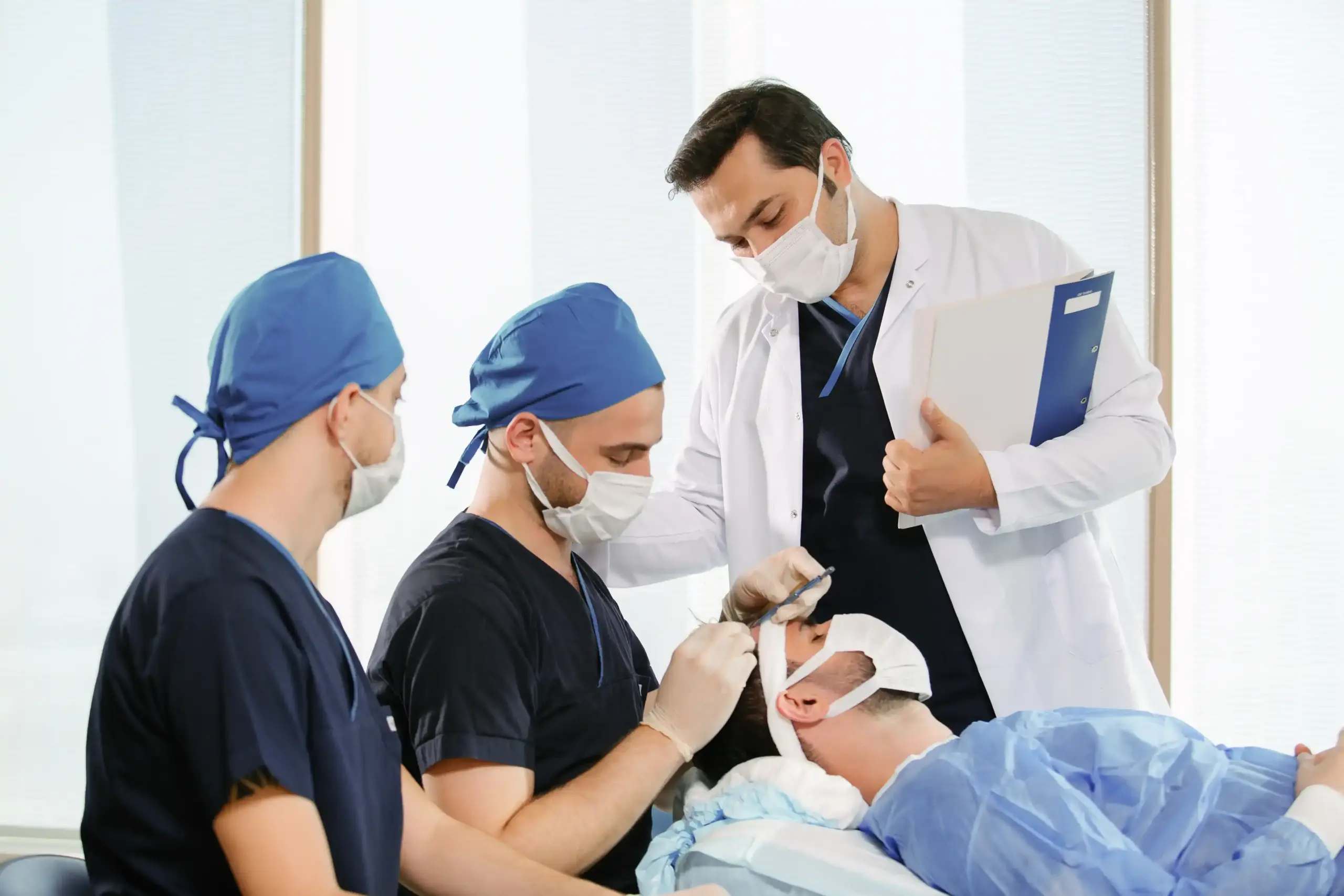 Dr. Balwi and surgical team performing a hair transplant procedure